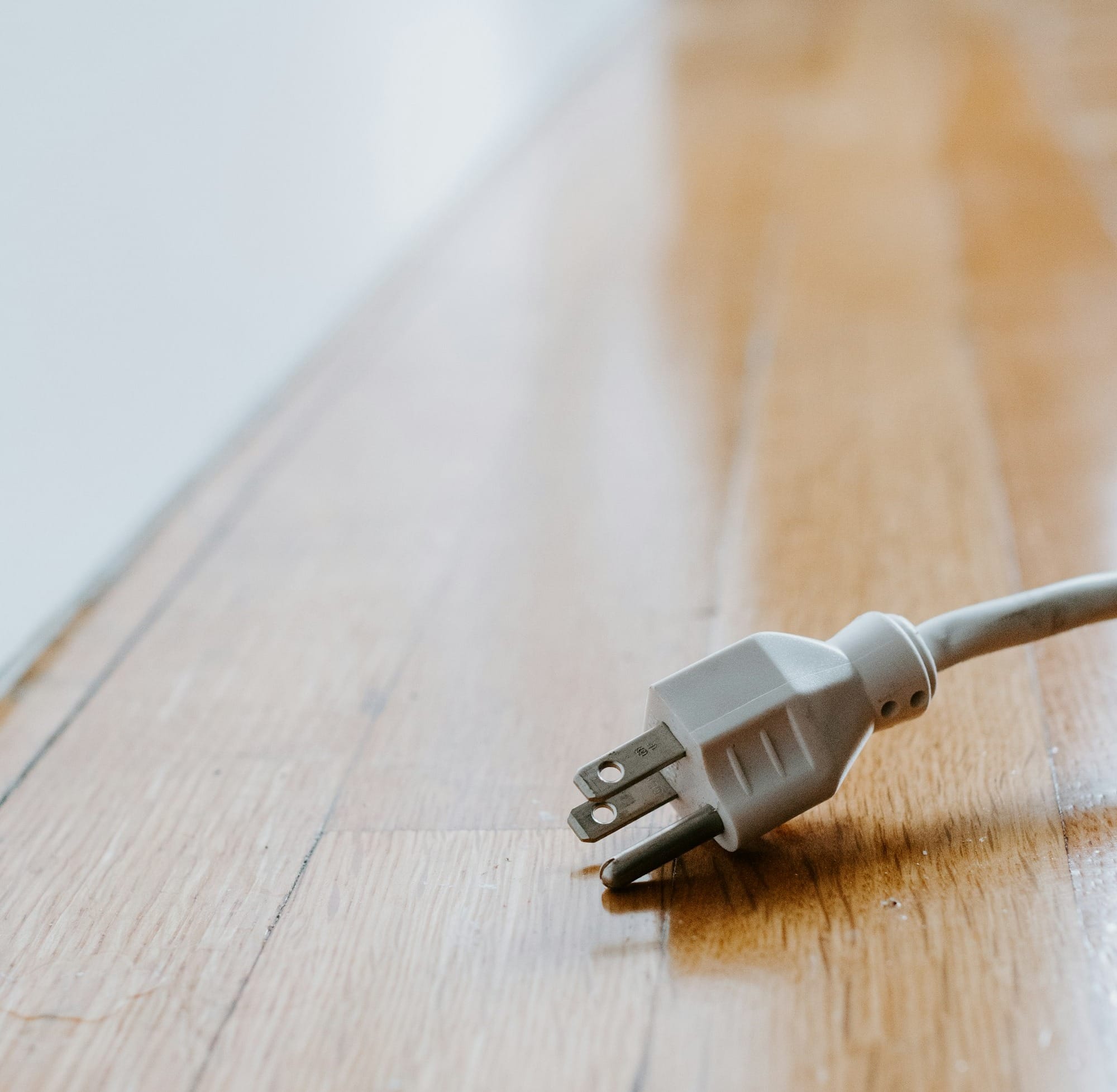 white usb cable on brown wooden table